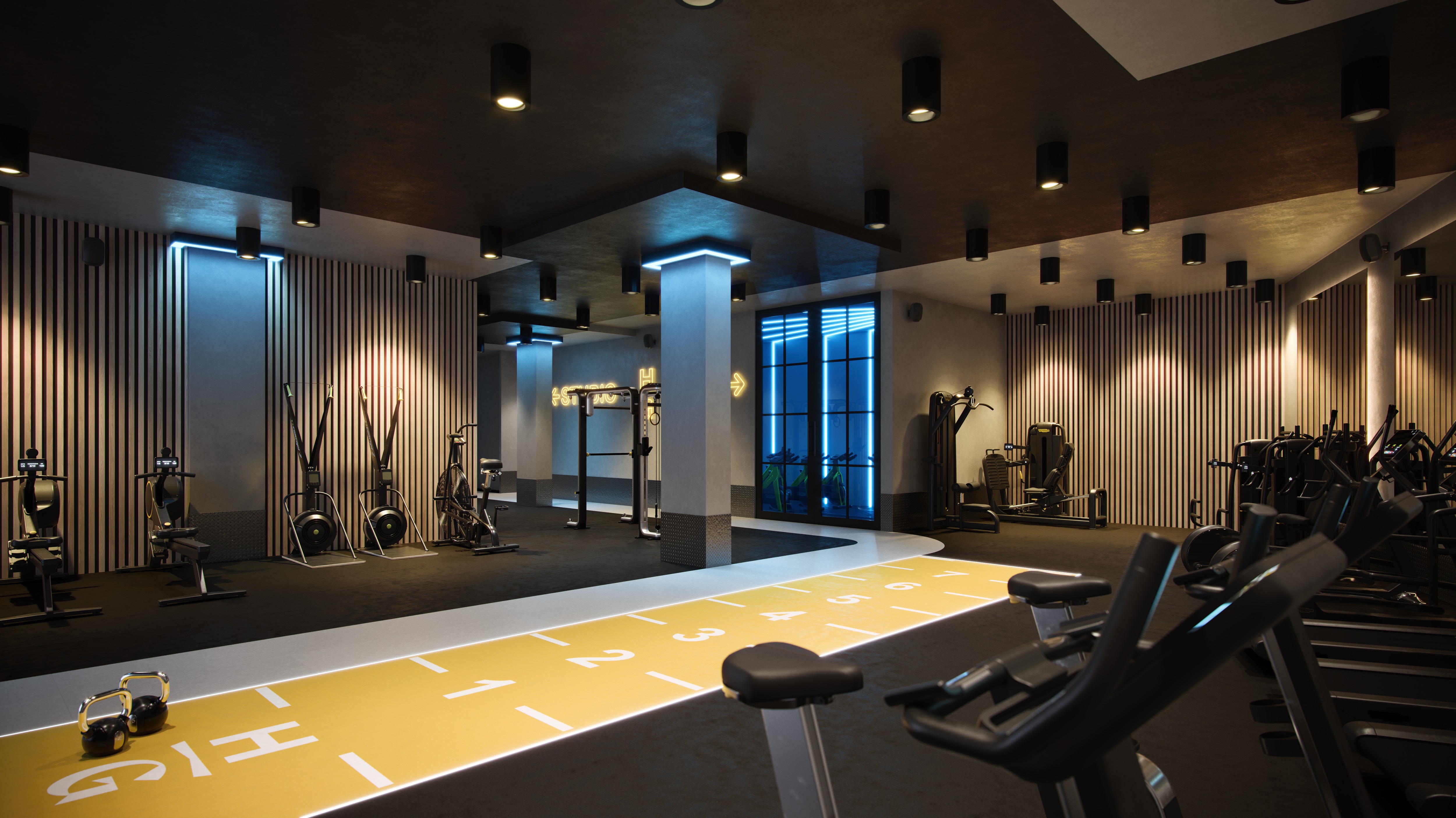 Modern gym with yellow sprint track and professional equipment