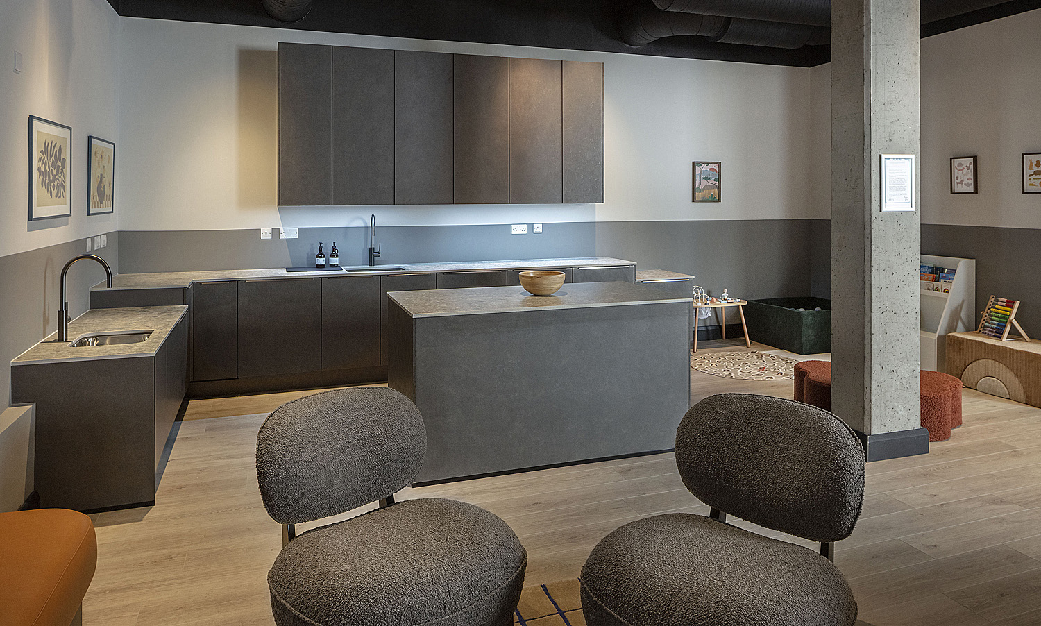 Communal kitchen with island and shared worktops