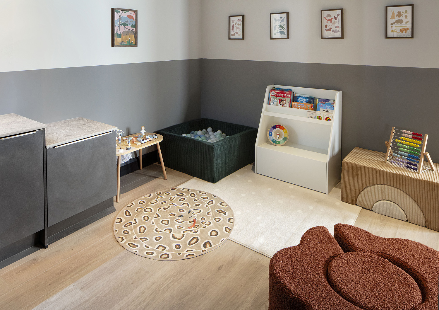 Children's play area with ball pit, books and soft seating